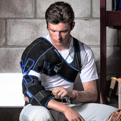 Male Baseball Athlete Wearing Shock Doctor Ice Recovery Shoulder Elbow Compression Wrap