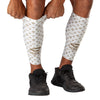 Shock Doctor White/Gold Lux Showtime Compression Calf Sleeves - Model Pulling Sleeve Over Calf/Shin