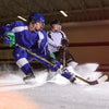 Youth Hockey Players Fighting Over Puck Wearing Shock Doctor Protective Gear and Accessories